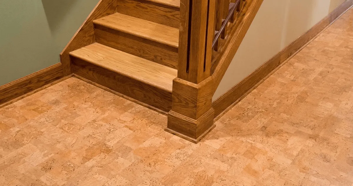 End of a staircase with cork flooring in Dallas, TX