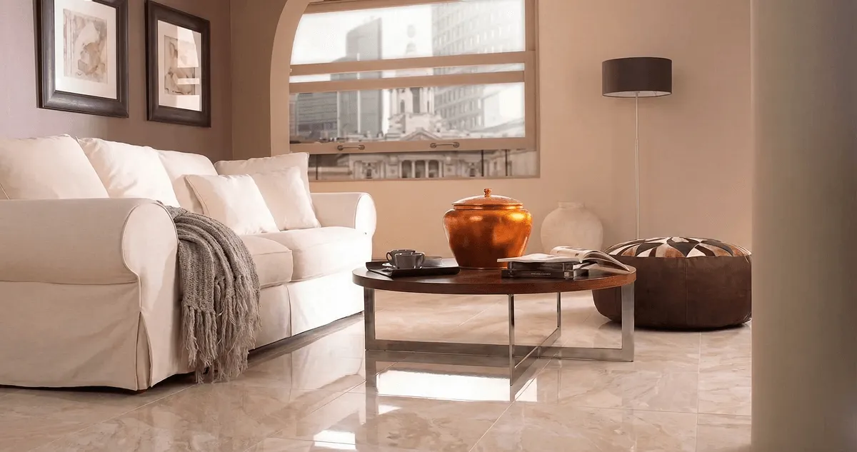 Modern living room with professionally installed marble flooring, a beige sofa, coffee table in Dallas, TX
