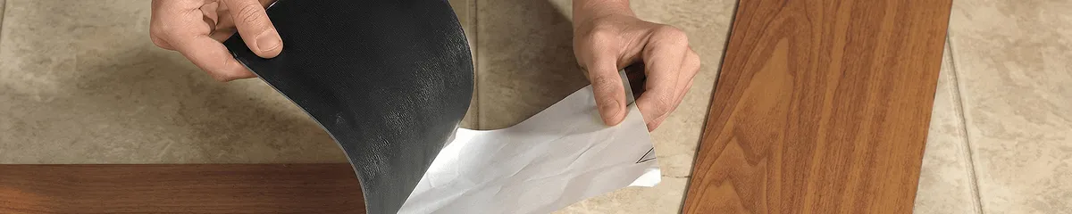 A professional installing vinyl flooring in Dallas, TX